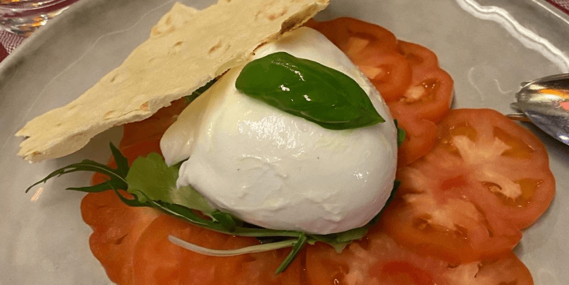 Caprese salad mozzarella di bufala tomatoes and basil - Pulcinella | Traditional Italian Pizza Delivery in Monaco